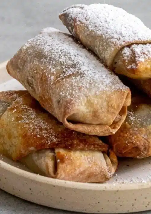 Delicious air fryer banana egg rolls served with a sweet dipping sauce