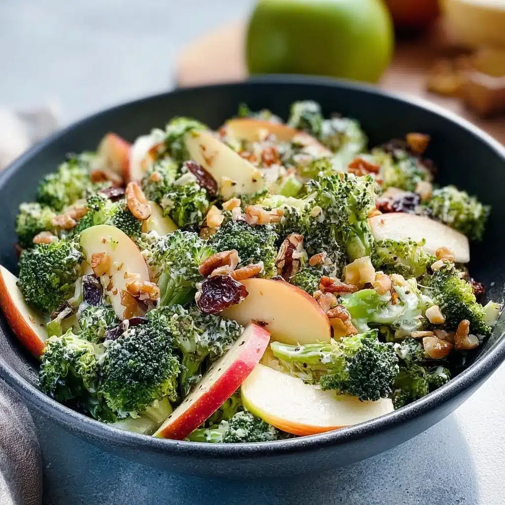 Fresh Broccoli Apple Salad with nuts and dressing, ideal for healthy eating.