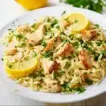 Creamy lemon chicken orzo recipe with fresh herbs and lemon zest
