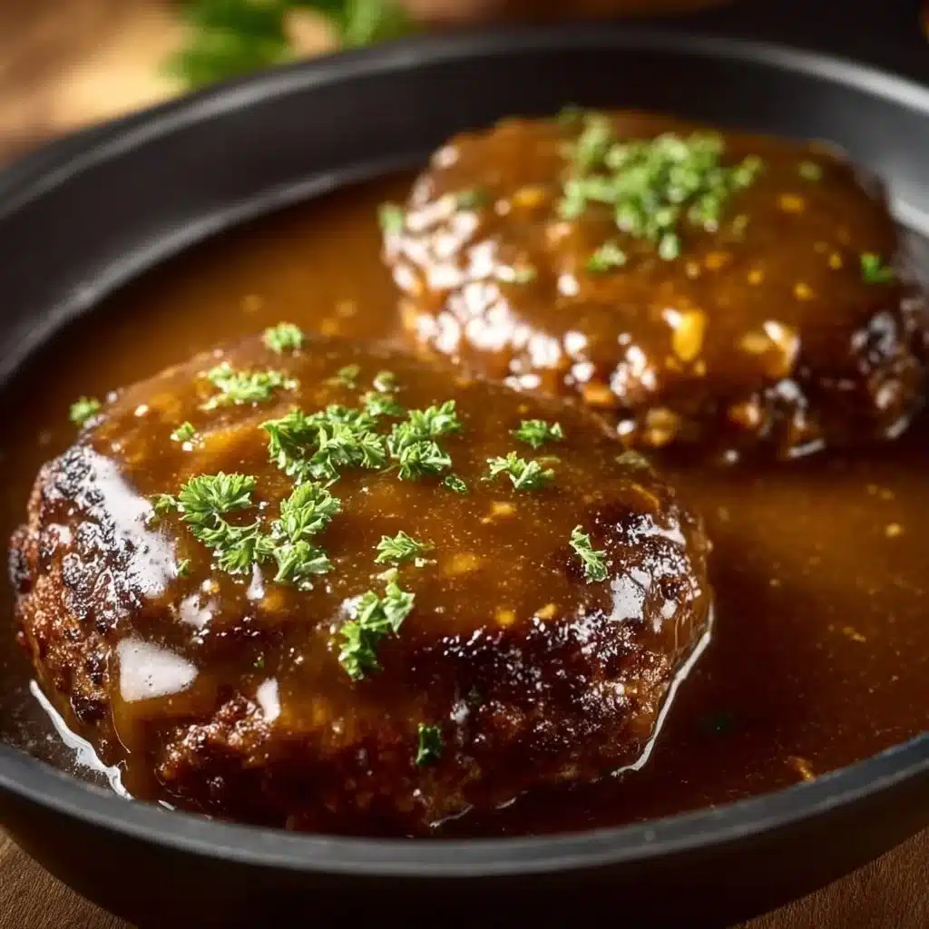 Delicious Crock Pot Salisbury Steak served with creamy mashed potatoes.