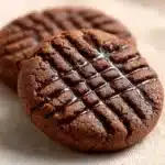 Soft chocolate peanut butter cookies on a plate for a delicious treat.