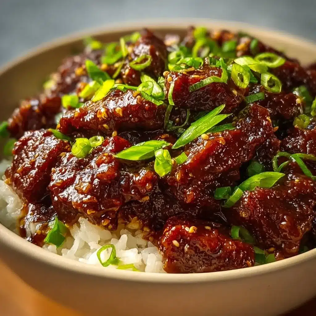 Deliciously tender Crockpot Mongolian Beef served with rice and vegetables