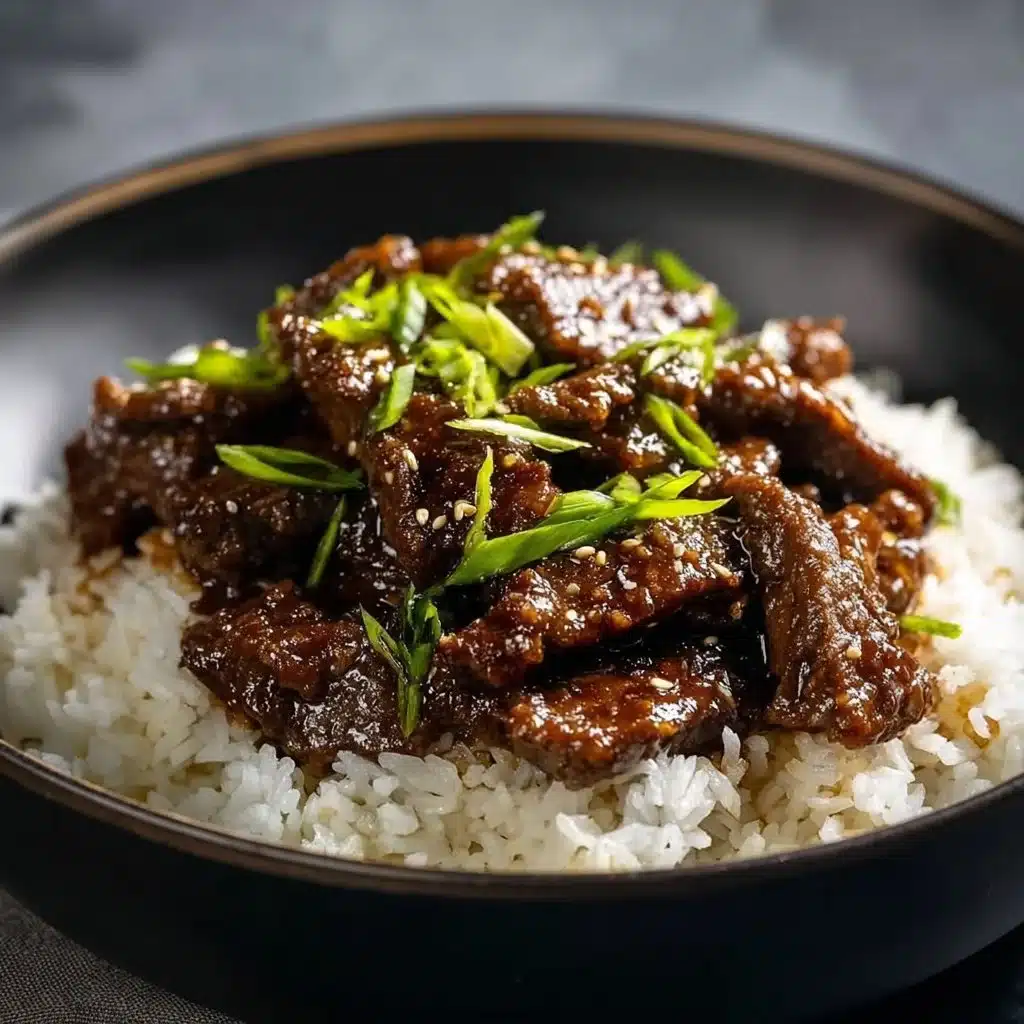 Delicious plate of Mongolian Beef stir-fry with tender meat and vegetables