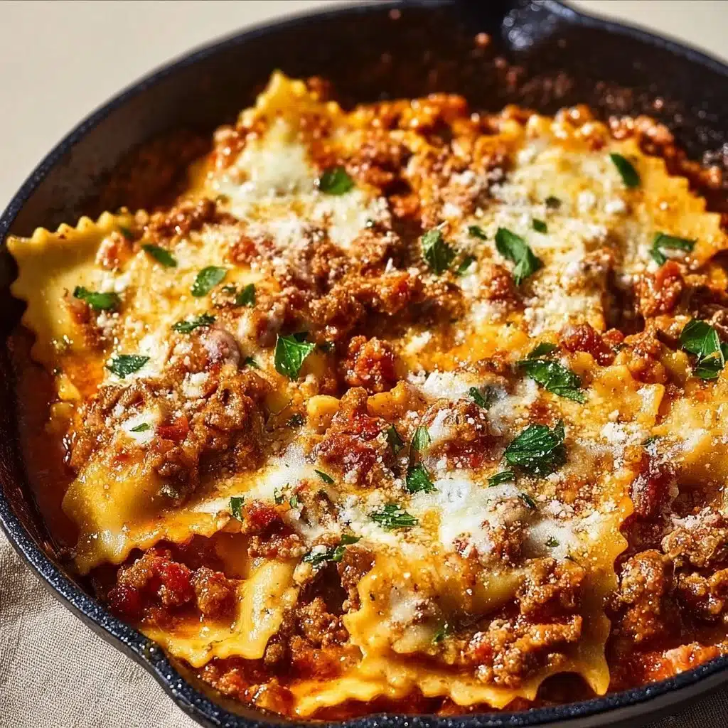 One pan skillet lasagna with layers of pasta, cheese, and meat in a skillet.