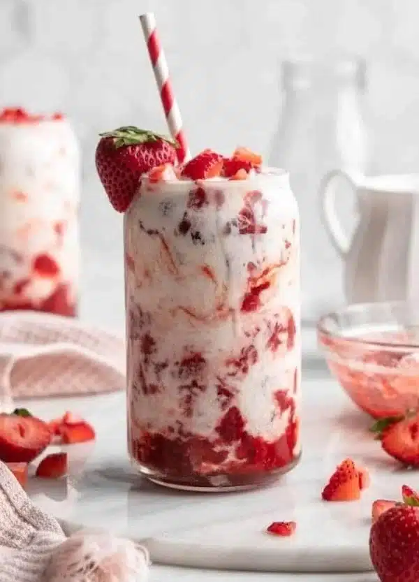 Glass of Vegan Korean Strawberry Milk with fresh strawberries