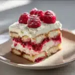 Delicious White Chocolate Raspberry Tiramisu garnished with fresh raspberries