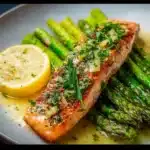 Baked salmon in foil with asparagus and lemon garlic butter sauce