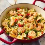 Pasta Primavera with Shrimp featuring colorful vegetables and shrimp in a light sauce.