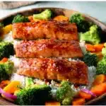 Sheet pan teriyaki salmon with colorful veggies on a baking sheet