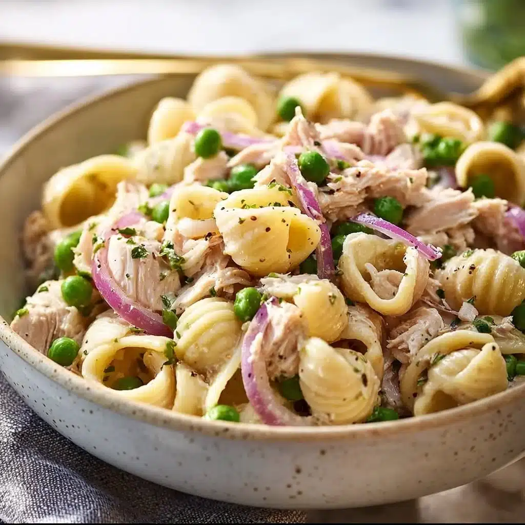 Delicious bowl of Tuna Pasta Salad with fresh vegetables and seasonings.